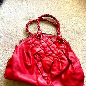 Read Valentino bag. Great condition. Used two or three times. Has cover bag